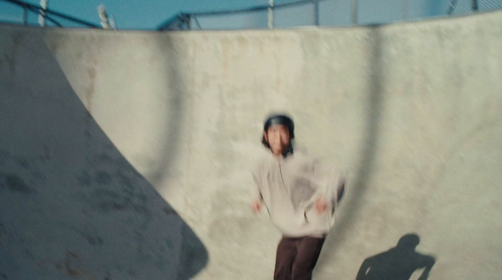 a man riding a skateboard up the side of a ramp