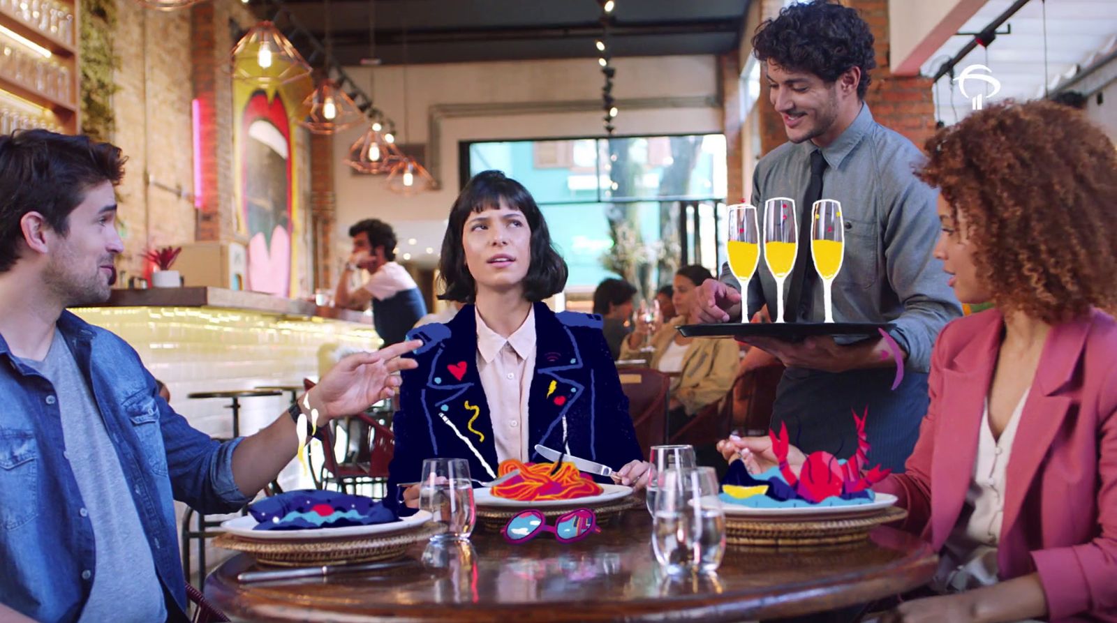 a group of people sitting around a table with plates of food