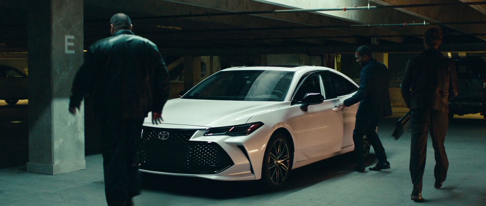 a white car parked in a parking garage