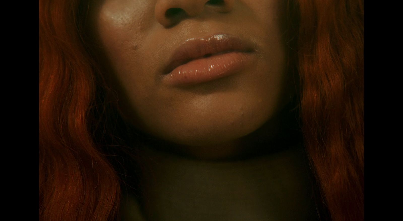 a close up of a woman with red hair