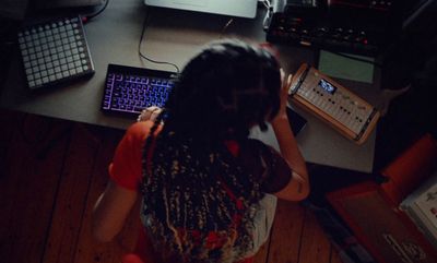 a person sitting at a desk with a laptop