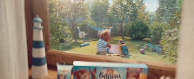 a picture of a child's backyard with toys and a book