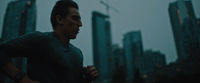 a man running in a city at night