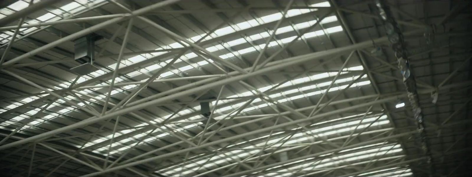 the ceiling of a train station with many windows