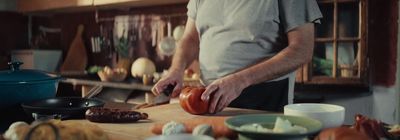 a man standing in a kitchen preparing food