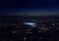 an aerial view of a stadium at night