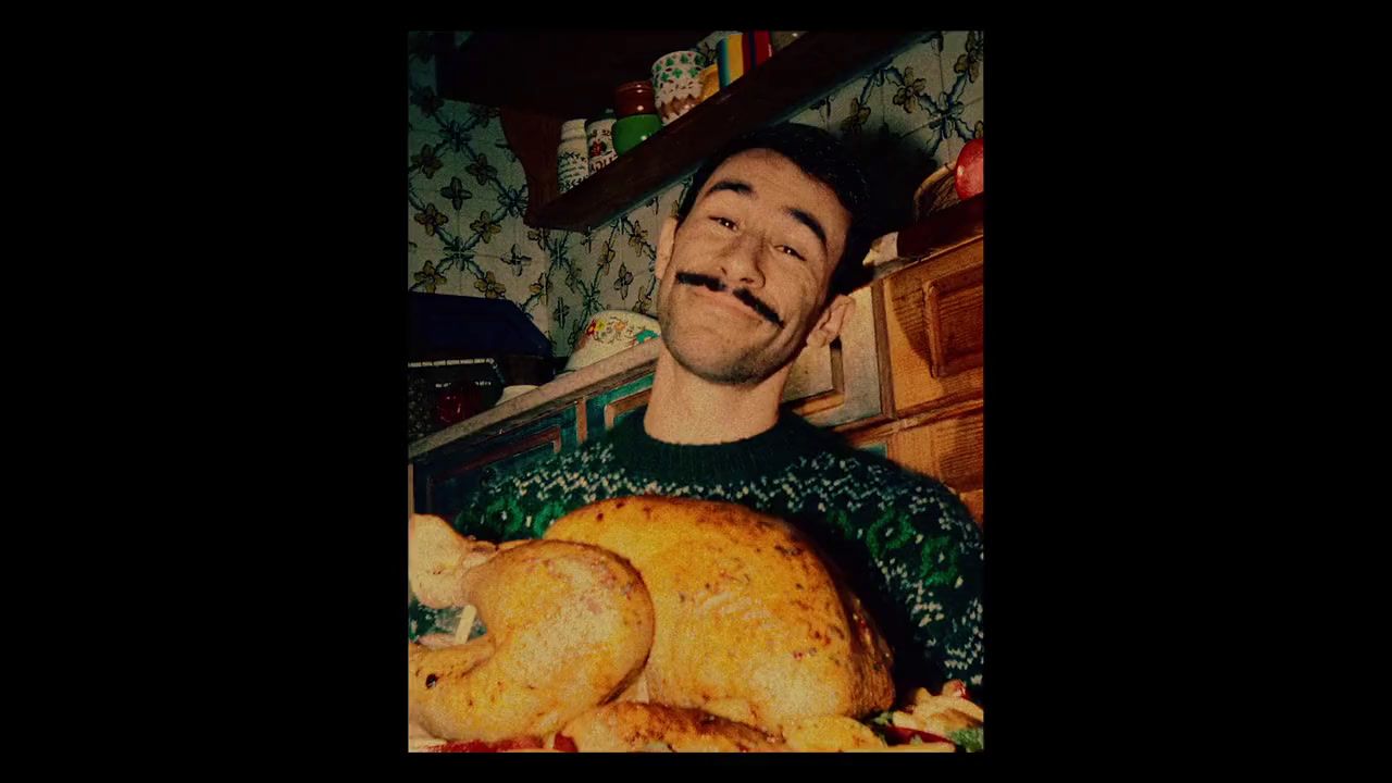 a man holding a large turkey in his hands