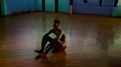 a man sitting on the floor in a room