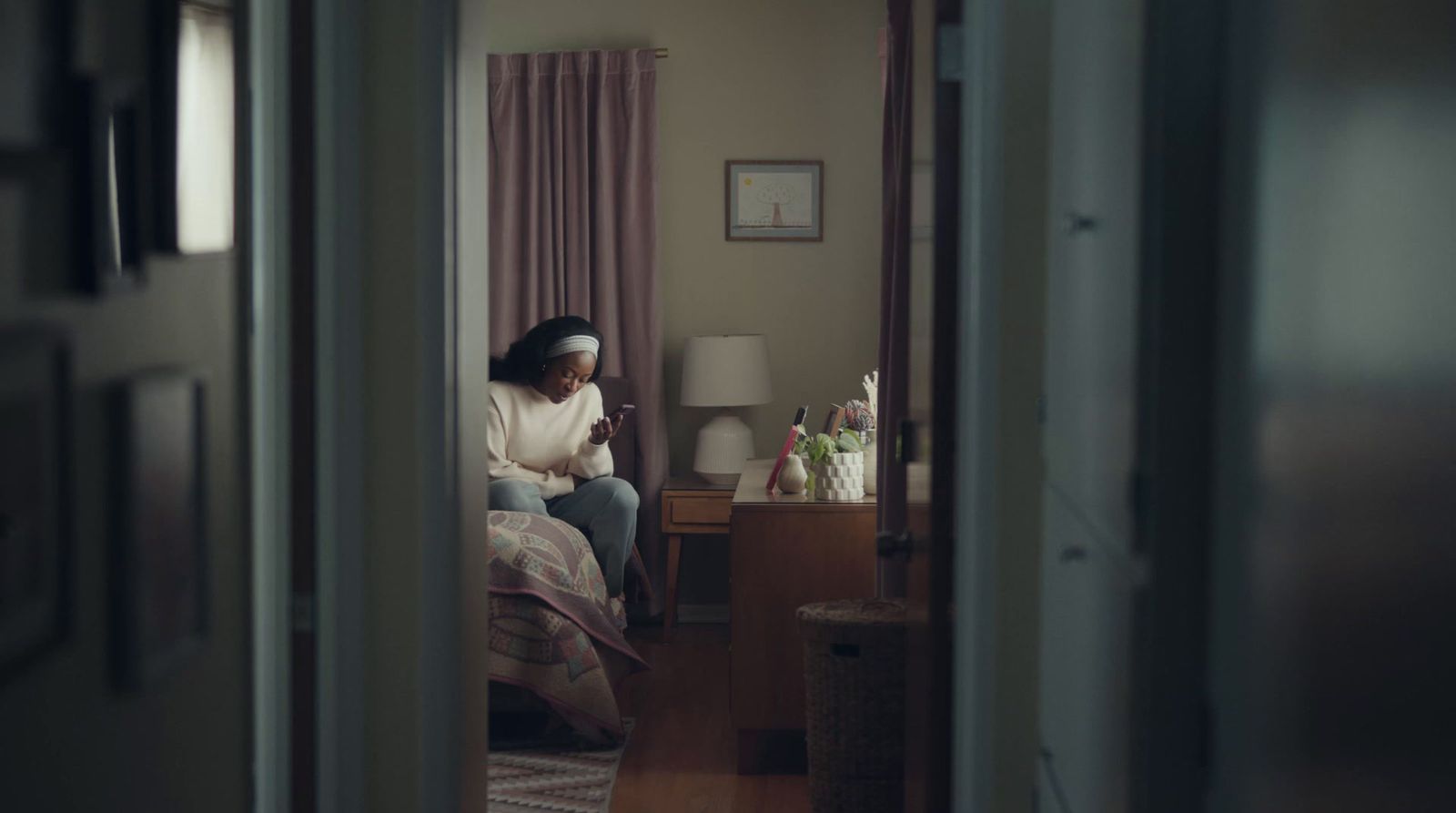 a woman sitting on a chair in a room