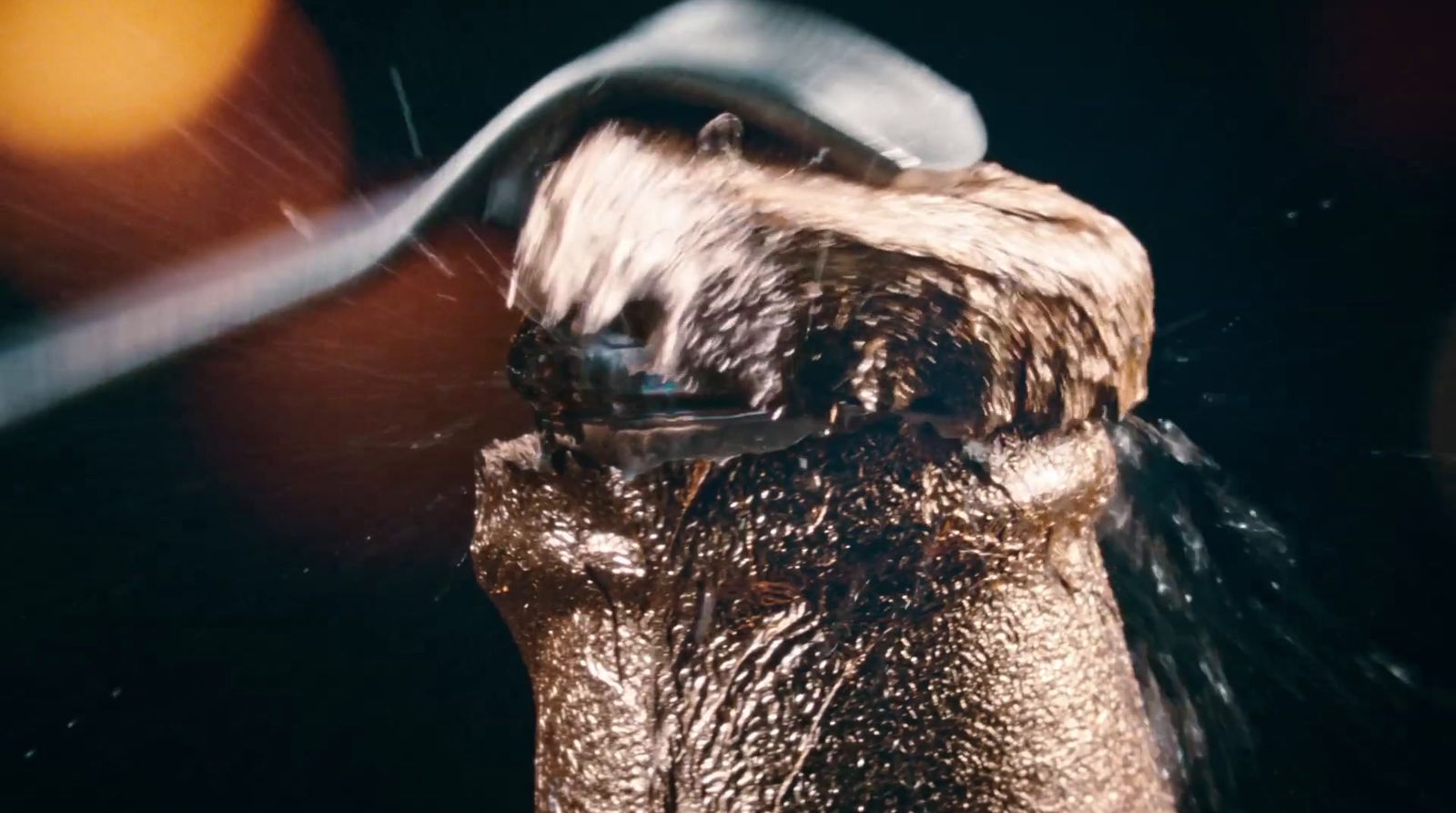 a close up of a hair dryer with water coming out of it