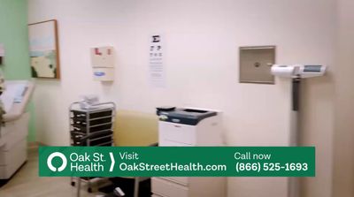 a hospital room with a green sign that says oak st visit