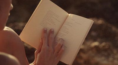 a person holding a book in their hands