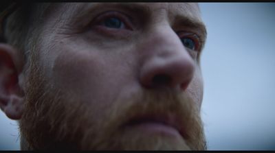 a close up of a man with a beard