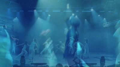 a group of people dancing on a stage