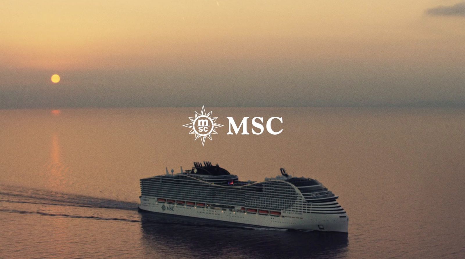 a large cruise ship in the middle of a body of water