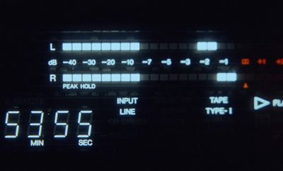 a close up of a digital clock in the dark