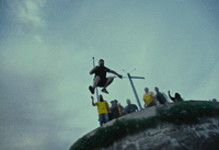 a man flying through the air while riding a skateboard