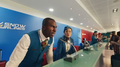 a man and a woman standing in front of a counter