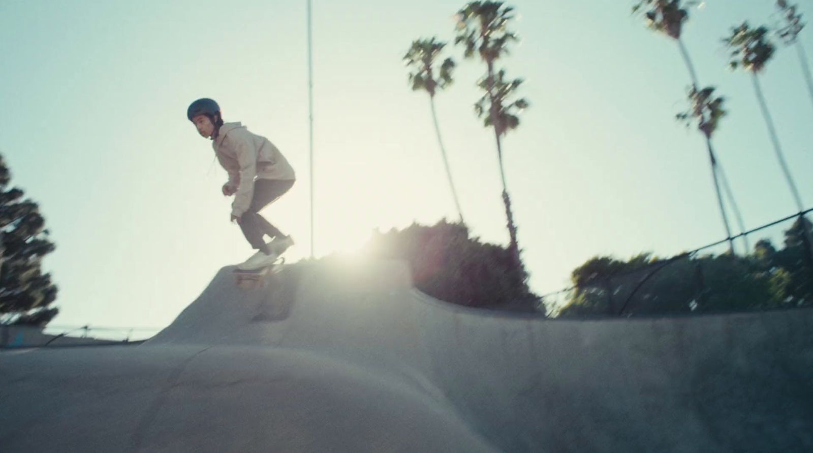 a man riding a skateboard up the side of a ramp