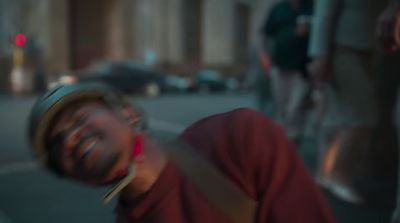 a blurry image of a man laughing on the street