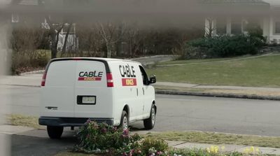 a white van parked on the side of a road