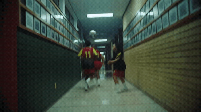 a group of people walking down a hallway