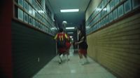 a group of people walking down a hallway