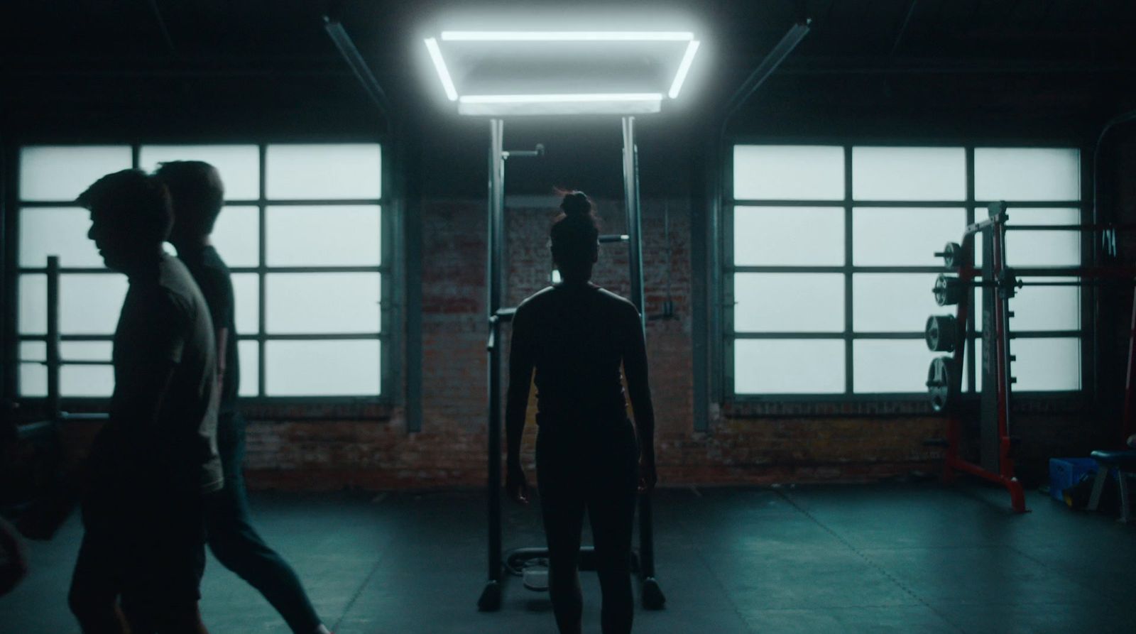 a group of people standing in a dark room