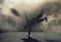 a person doing a handstand on a stage