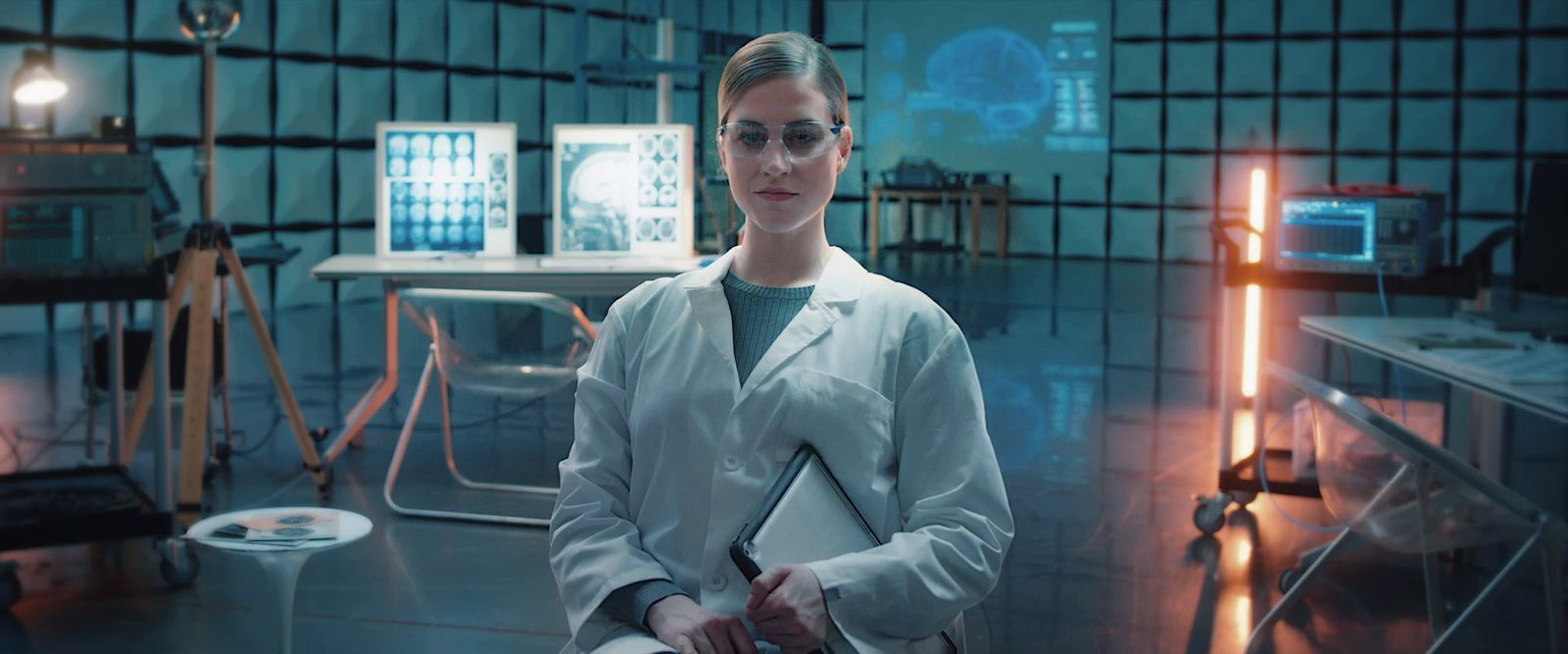 a woman in a lab coat standing in a room