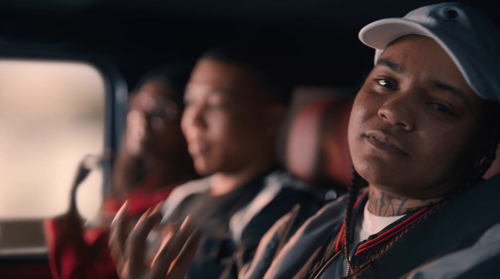 a group of people sitting in a row on a bus