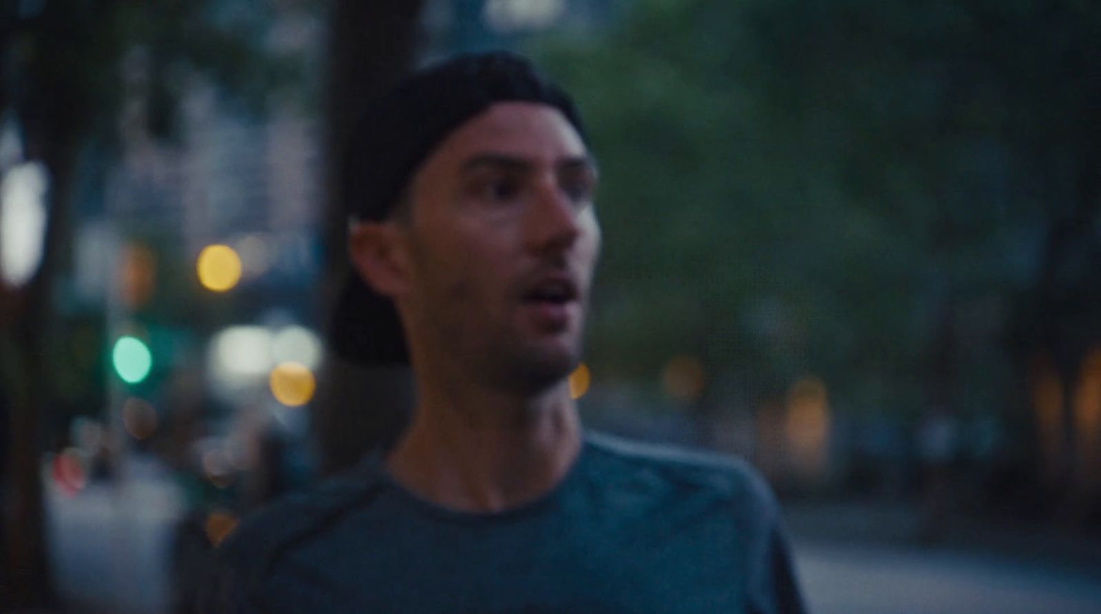 a man standing on a street corner with a surprised look on his face