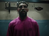 a man standing in front of a mirror in a bathroom