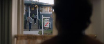 a person standing in front of a house