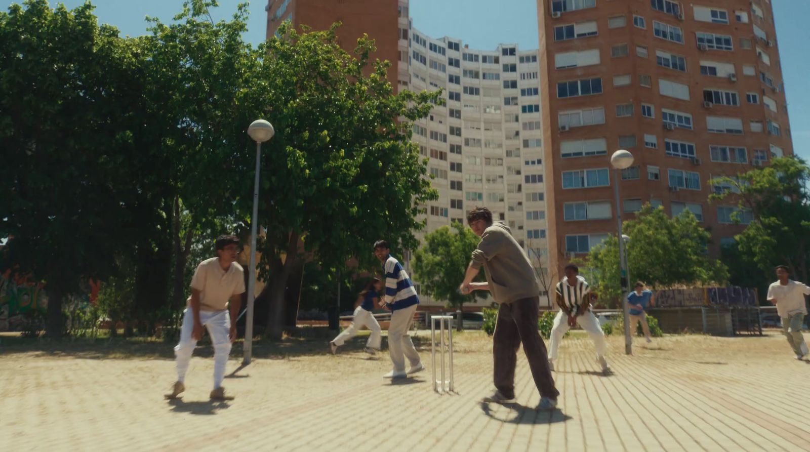 a group of men playing a game of croquet