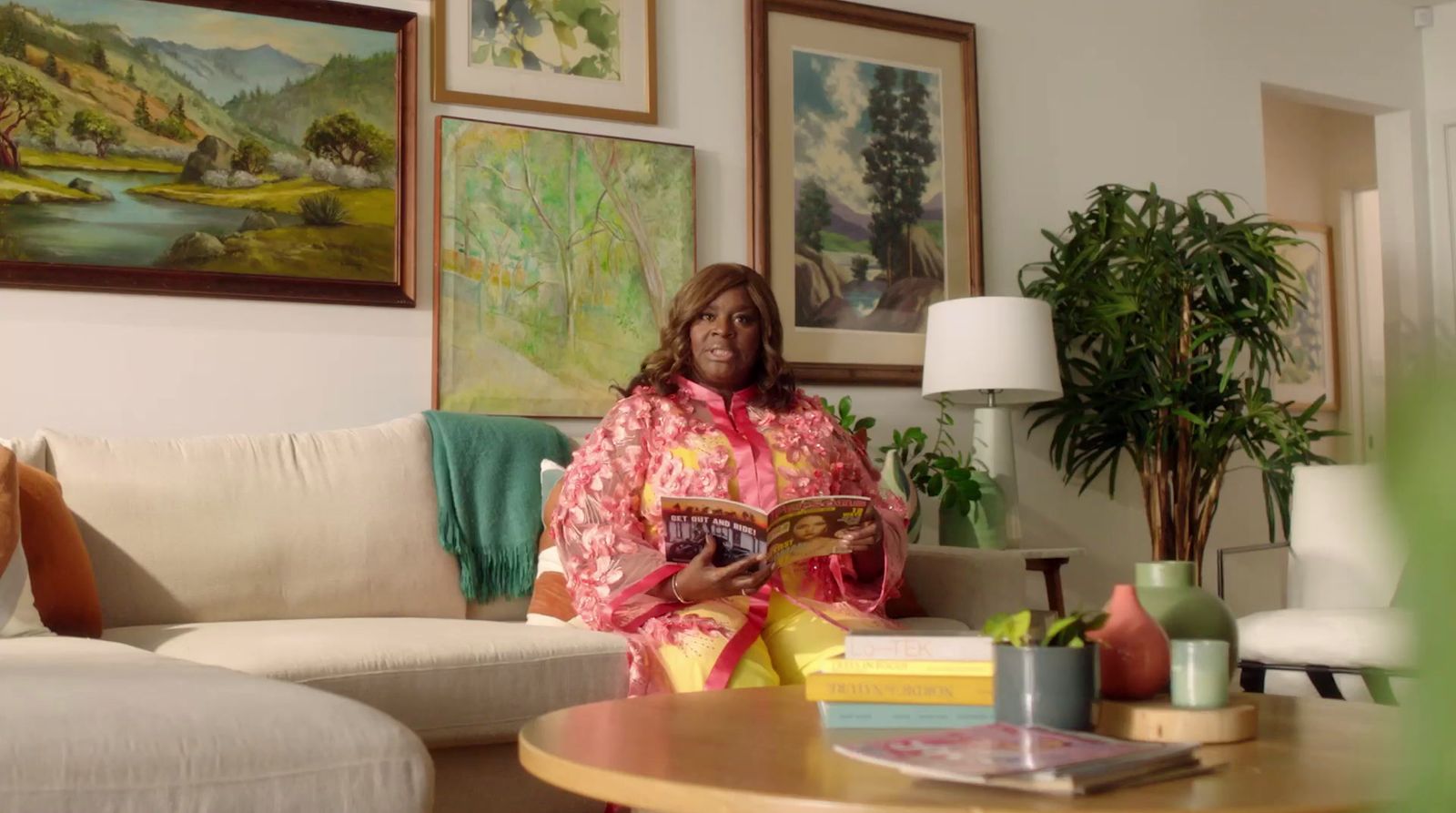 a woman sitting on a couch in a living room