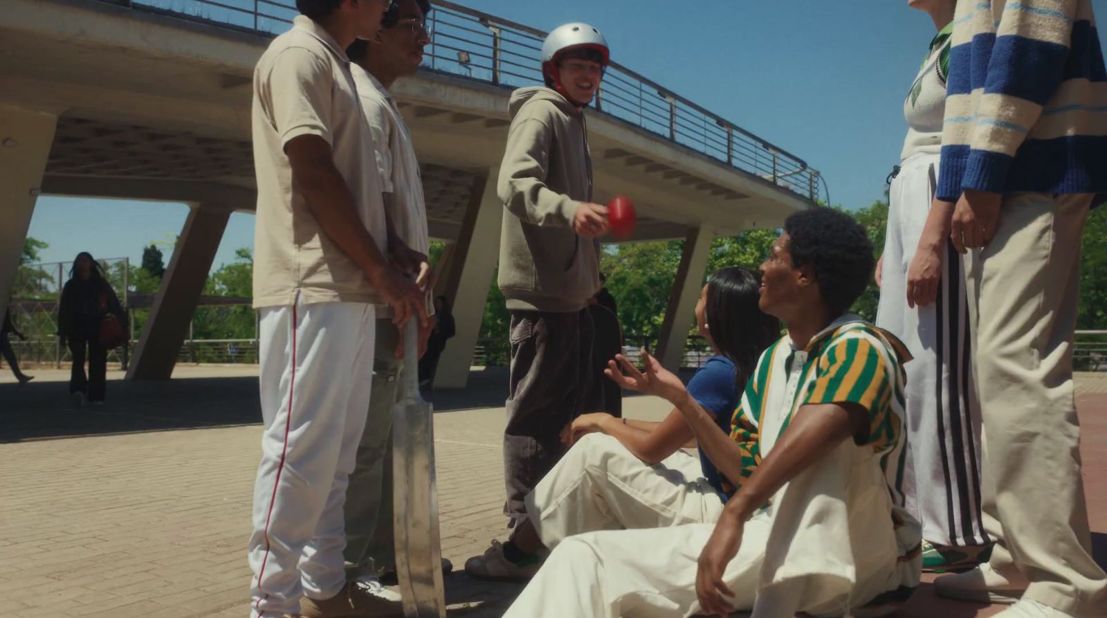 a group of young men standing around each other