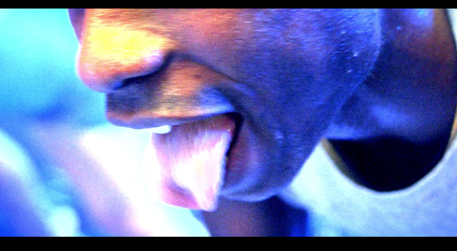 a close up of a person with their mouth open