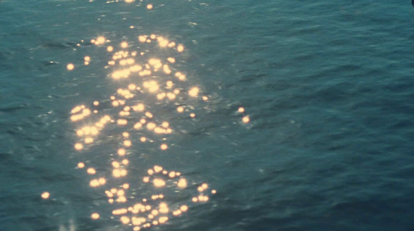 a long line of lights on the side of a boat