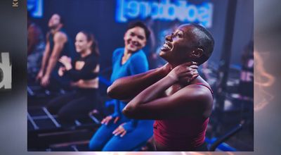 a group of women in a gym doing exercises