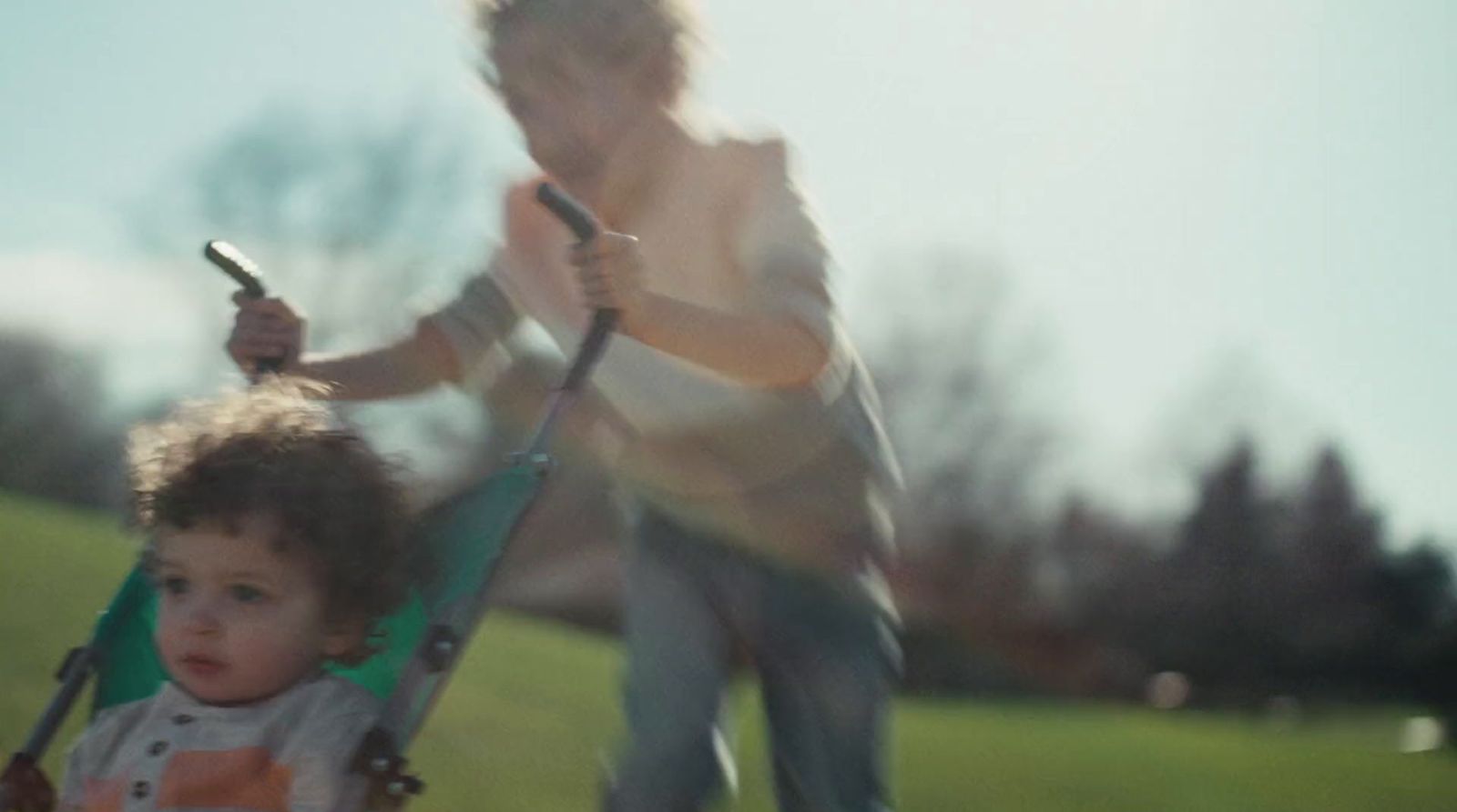 a woman pushing a baby in a stroller