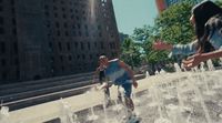 a man riding a skateboard down a water fountain