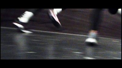 a blurry photo of a person's feet on a skateboard