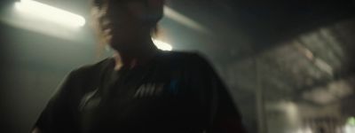 a blurry photo of a man in a dark room