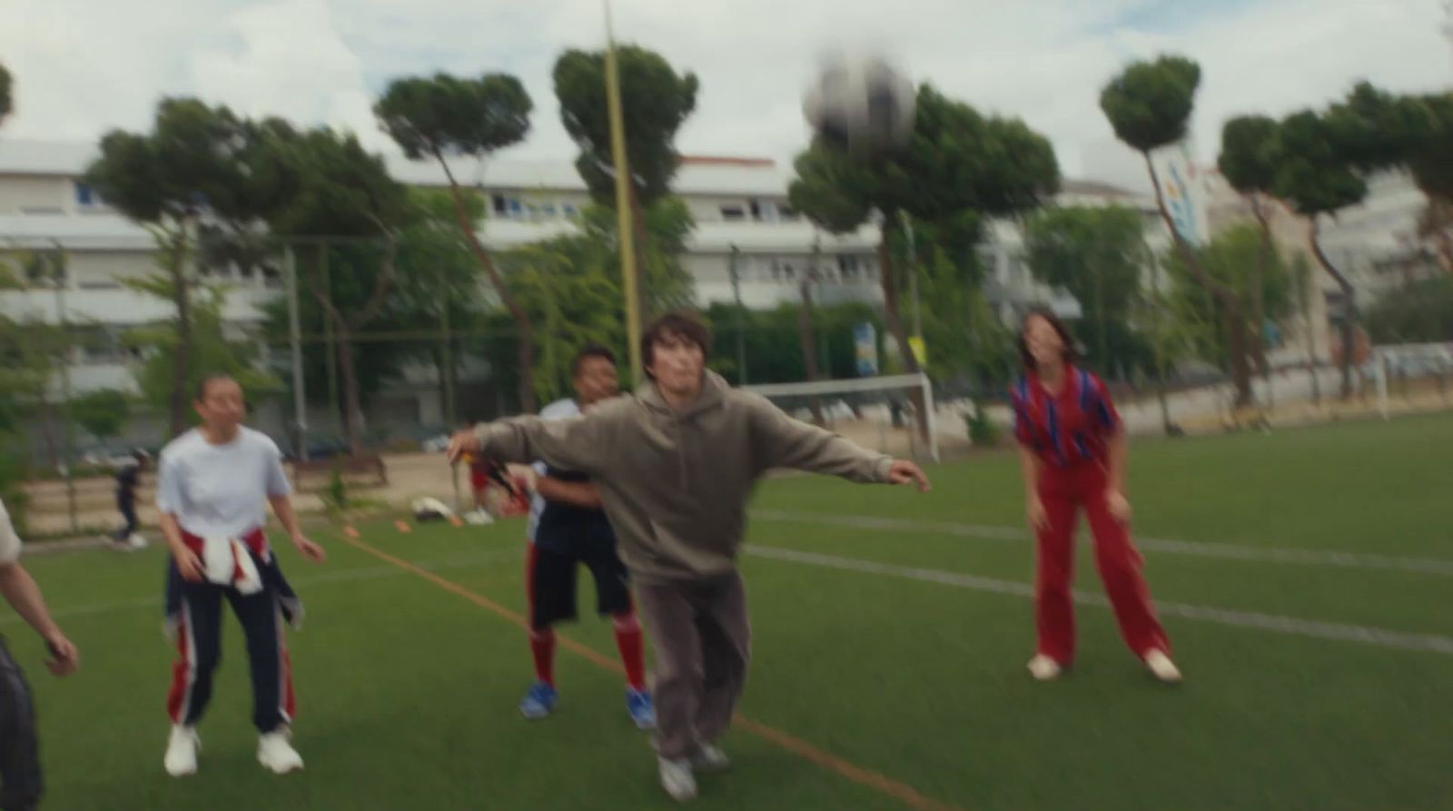 a group of young people playing a game of soccer