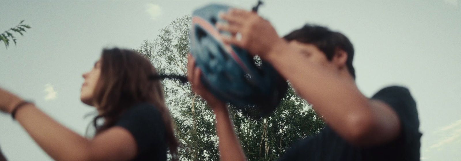 a man and a woman holding a baseball mitt