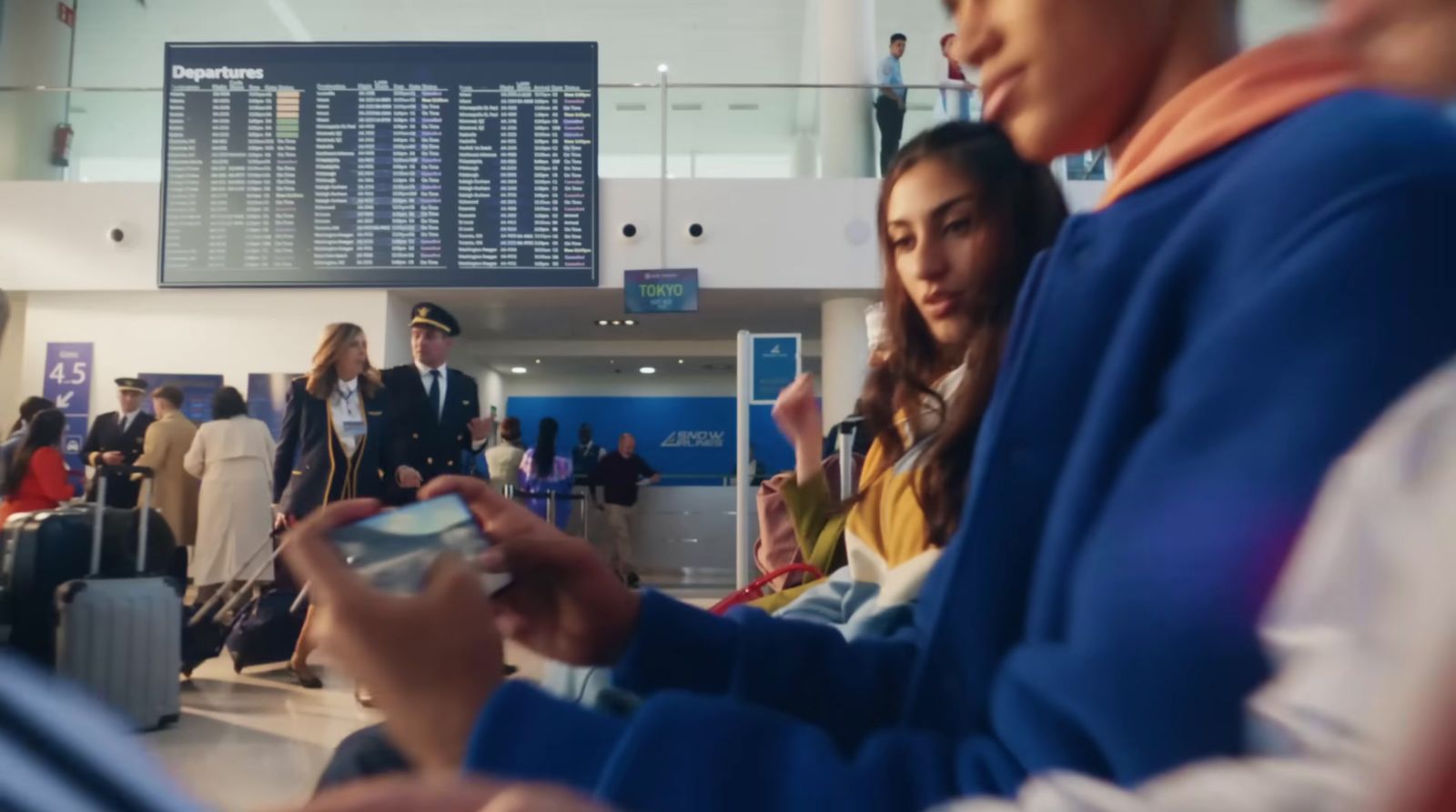 a group of people waiting in line at an airport