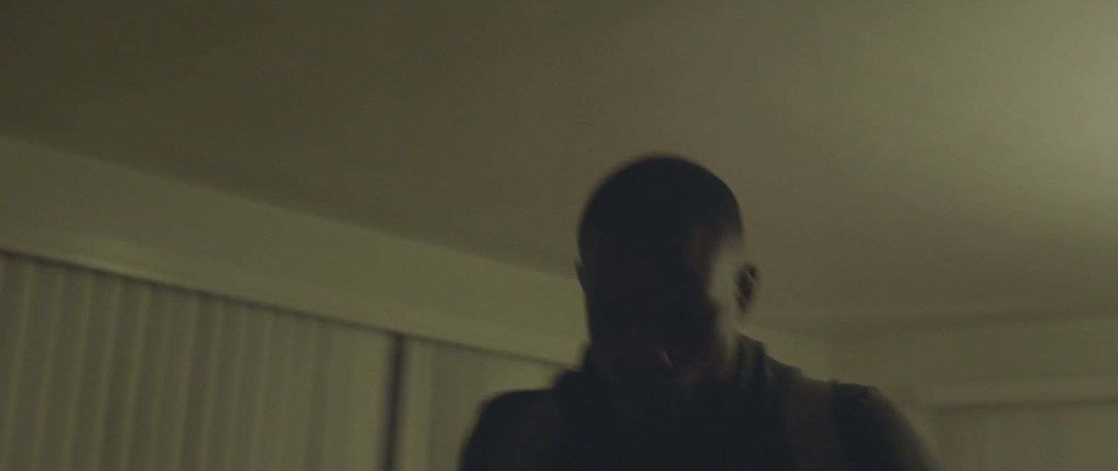 a blurry image of a person standing in a room