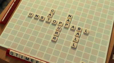 a scrabble board with letters that spell out words