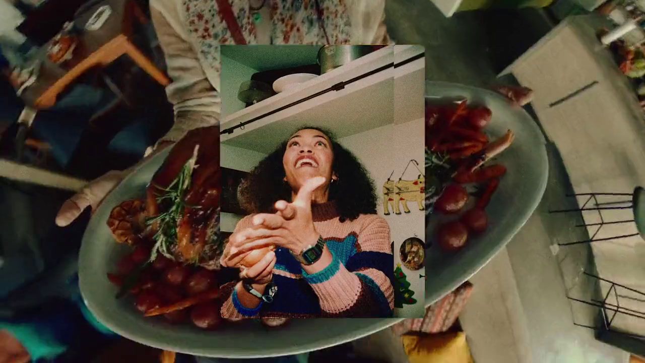 a woman is holding a plate of food